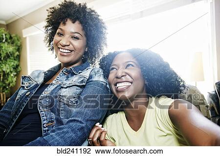 Stock Image - Portrait of smiling women. Fotosearch
