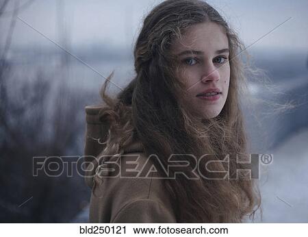 Portrait of wind blowing hair of serious Caucasian teenage girl View Large Photo Image Stock Image - Portrait of wind blowing hair of serious Caucasian teenage girl. Fotosearch