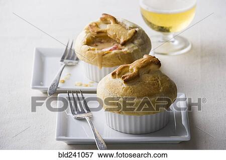 Pot pies with forks on plates View Large Photo Image Stock Photo - Pot pies with forks on plates. Fotosearch