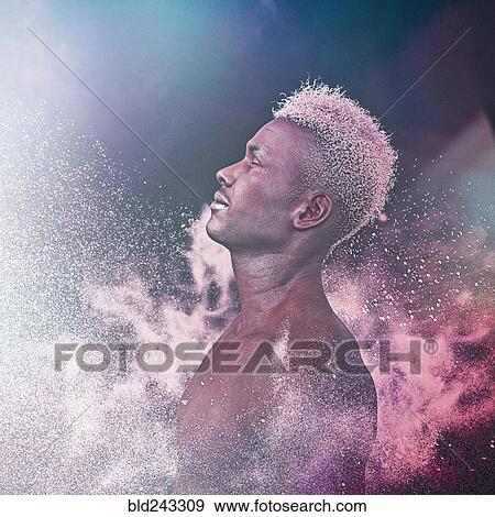 Powder splashing on man with bare chest View Large Photo Image Stock Photo - Powder splashing on man with bare chest. Fotosearch