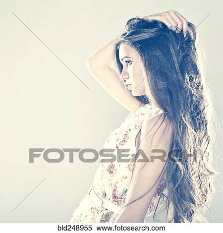 Stock Photography - Profile of pensive Caucasian teenage girl. Fotosearch