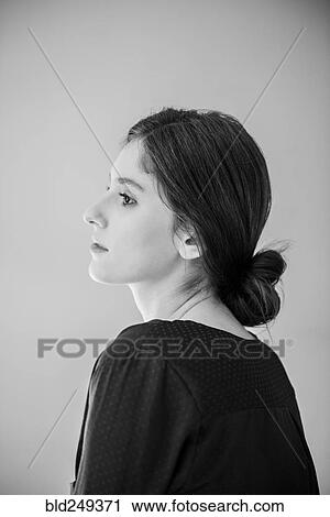 Stock Image - Profile of pensive Caucasian woman . Fotosearch