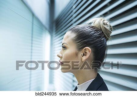 Profile of serious Mixed Race businesswoman in corridor View Large Photo Image Stock Photography - Profile of serious Mixed Race businesswoman in corridor. Fotosearch