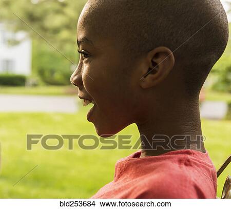 Profile of smiling African American boy View Large Photo Image Picture - Profile of smiling African American boy. Fotosearch