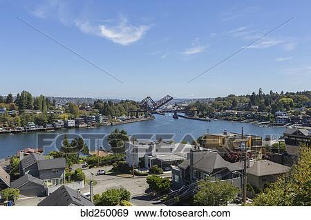 Stock Photo - Raised bridge on urban river. Fotosearch