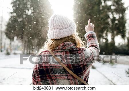 Rear view of Caucasian woman outdoors in snow View Large Photo Image Stock Image - Rear view of Caucasian woman outdoors in snow. Fotosearch