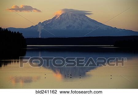 Reflection of clouds and mountain in river at sunset View Large Photo Image Stock Image - Reflection of clouds and mountain in river at sunset. Fotosearch