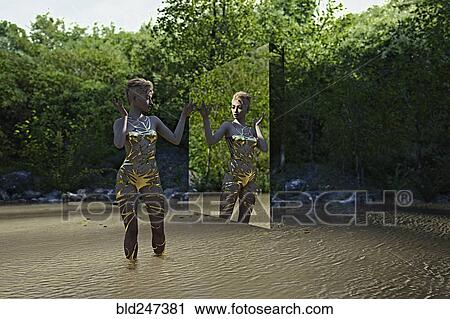 Reflection of woman in virtual mirror standing in river View Large Photo Image Stock Image - Reflection of woman in virtual mirror standing in river. Fotosearch