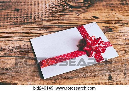 Ribbon on valentine card on wooden table View Large Photo Image Stock Photo - Ribbon on valentine card on wooden table. Fotosearch