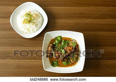 Stock Photograph - Rice and meat in bowls. Fotosearch