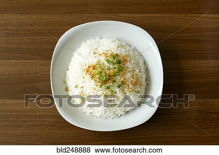 Stock Photo - Rice and onions in bowl. Fotosearch