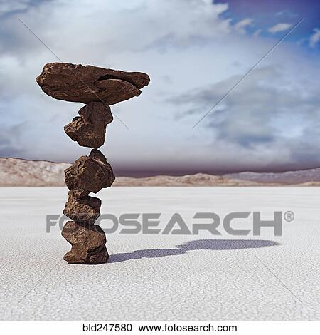 Stock Image - Rocks balancing in desert. Fotosearch