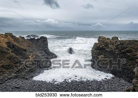 Rocks on beach near ocean, Hellissandur, Snaellsnes peninsula, Iceland View Large Photo Image Stock Image - Rocks on beach near ocean, Hellissandur, Snaellsnes peninsula, Iceland. Fotosearch