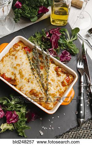 Stock Photo - Rosemary on casserole in pan. Fotosearch