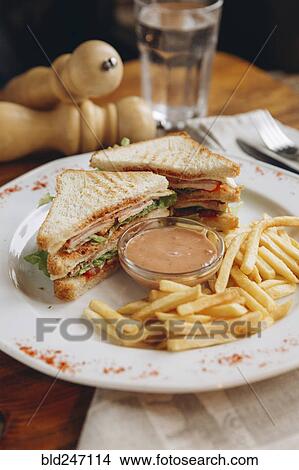Sandwich with french fries on plate View Large Photo Image Picture - Sandwich with french fries on plate. Fotosearch