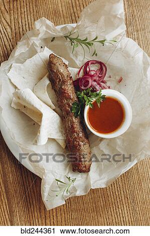 Sausage and bread with sauce on plate View Large Photo Image Stock Image - Sausage and bread with sauce on plate. Fotosearch