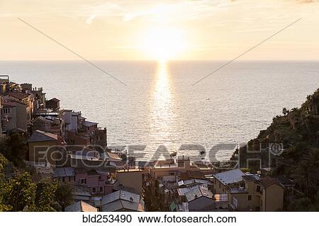 Stock Image - Scenic ocean view of waterfront, Manarola, Liguria, Italy. Fotosearch
