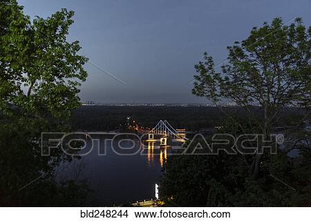 Scenic view of bridge over river at night View Large Photo Image Picture - Scenic view of bridge over river at night. Fotosearch