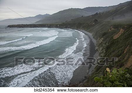 Picture - Scenic view of ocean beach and cliffs. Fotosearch
