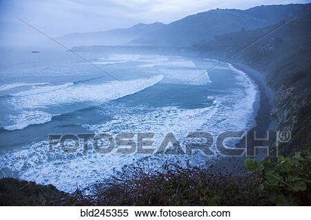Scenic view of ocean beach and cliffs View Large Photo Image Stock Photography - Scenic view of ocean beach and cliffs. Fotosearch