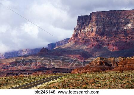 Stock Photo - Scenic view of road in desert landscape. Fotosearch