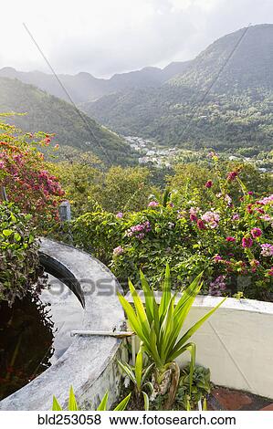 Stock Photo - Scenic view of valley and mountains. Fotosearch