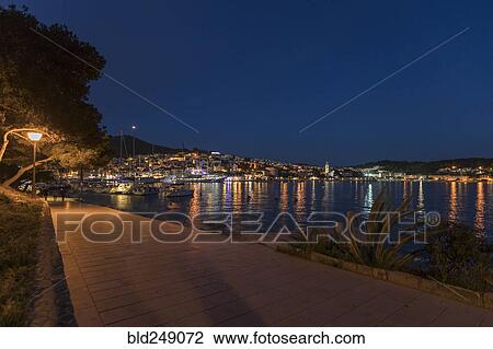 Stock Image - Scenic view of waterfront at night. Fotosearch