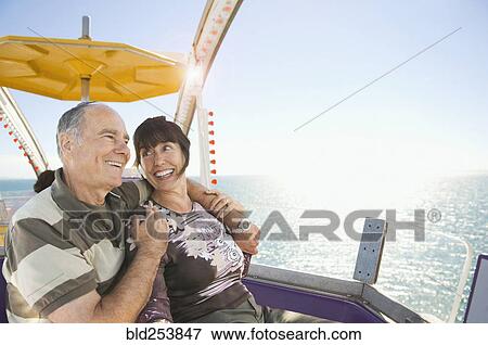 Senior couple sitting near ocean View Large Photo Image Stock Photo - Senior couple sitting near ocean. Fotosearch