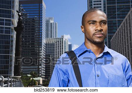 Serious African American businessman in city View Large Photo Image Stock Photo - Serious African American businessman in city. Fotosearch