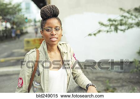 Serious African American woman with braids wearing eyeglasses View Large Photo Image Stock Photography - Serious African American woman with braids wearing eyeglasses. Fotosearch