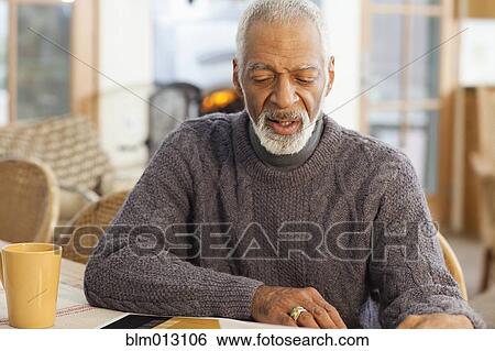 Stock Photograph - Serious Black man. Fotosearch