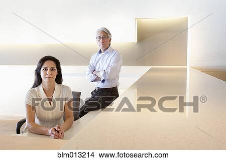 Picture - Serious business people in office. Fotosearch