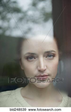 Serious Caucasian woman behind foggy window View Large Photo Image Stock Photo - Serious Caucasian woman behind foggy window. Fotosearch