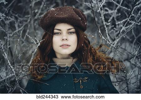 Serious Caucasian woman near icy branches View Large Photo Image Stock Image - Serious Caucasian woman near icy branches. Fotosearch
