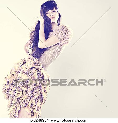 Picture - Serious Caucasian woman wearing ruffled skirt. Fotosearch