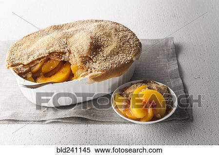 Serving of peach cobbler View Large Photo Image Stock Photography - Serving of peach cobbler. Fotosearch
