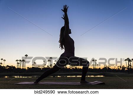 Silhouette of Hispanic woman performing yoga at sunset View Large Photo Image Stock Image - Silhouette of Hispanic woman performing yoga at sunset. Fotosearch