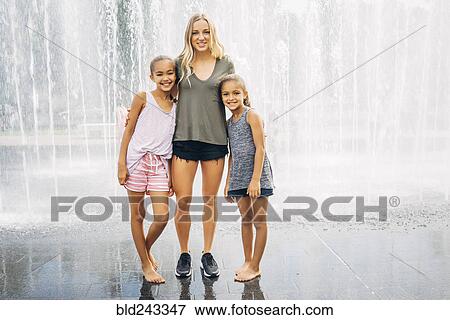 Sisters posing near fountain View Large Photo Image Stock Photo - Sisters posing near fountain. Fotosearch