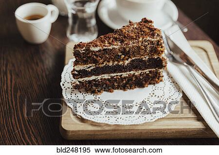 Slice of layer cake on doily View Large Photo Image Stock Photography - Slice of layer cake on doily. Fotosearch