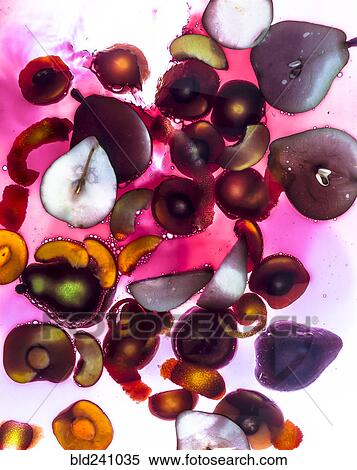 Stock Photography - Sliced fruit floating in sangria. Fotosearch