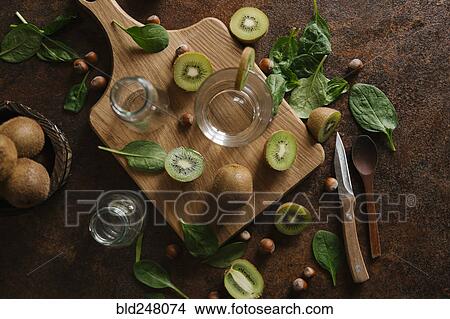 Sliced kiwi on cutting board View Large Photo Image Picture - Sliced kiwi on cutting board. Fotosearch