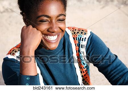 Stock Image - Smiling African American woman. Fotosearch