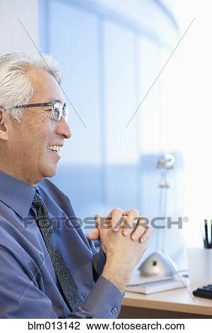 Stock Image - Smiling Asian businessman. Fotosearch