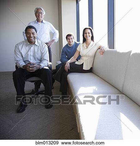 Stock Photo - Smiling business people in office lobby. Fotosearch