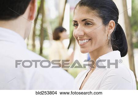 Smiling business people outdoors View Large Photo Image Picture - Smiling business people outdoors. Fotosearch