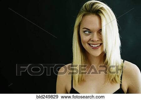 Smiling Caucasian woman looking away View Large Photo Image Stock Photo - Smiling Caucasian woman looking away. Fotosearch