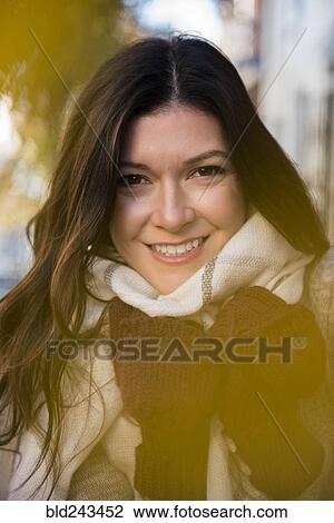 Smiling Caucasian woman wearing gloves and scarf View Large Photo Image Stock Image - Smiling Caucasian woman wearing gloves and scarf. Fotosearch