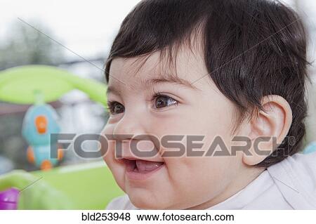 Stock Photo - Smiling Hispanic baby boy. Fotosearch