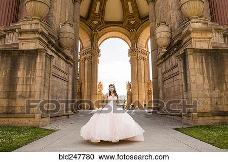 Smiling Hispanic girl wearing gown View Large Photo Image Stock Image - Smiling Hispanic girl wearing gown. Fotosearch