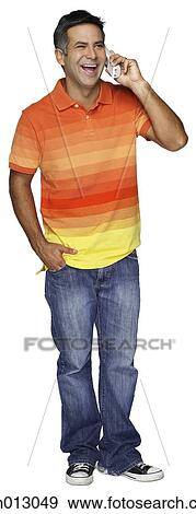 Stock Photo - Smiling man talking on telephone. Fotosearch